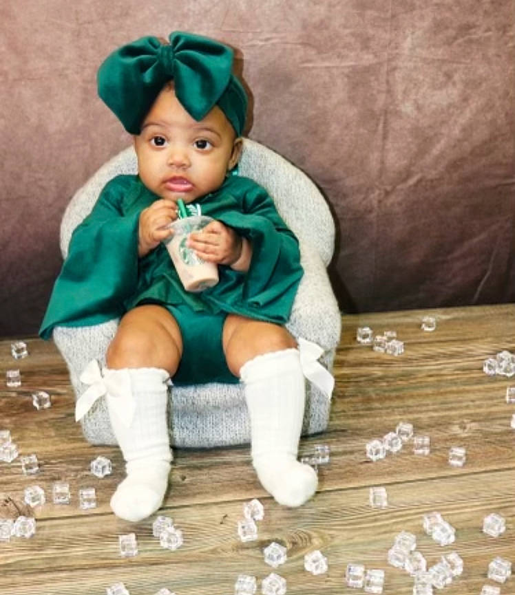 Kehlani joined the competition — help win amazing prizes! bangs, child, doll, dress, eye, fashion_accessory, fawn, foot, fur, hair, hardwood, head, headwear, jewellery, person, sitting, sock, toy, wig, wood