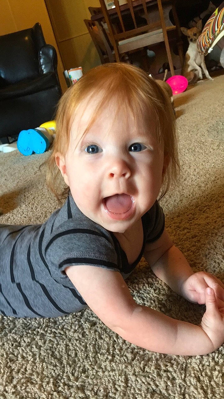 Marissa joined the competition — help win amazing prizes! baby, baby_toddler_clothing, chair, cheek, comfort, eye, facial_expression, finger, floor, flooring, fun, iris, mouth, nose, person, room, skin, sleeve, smile, toddler