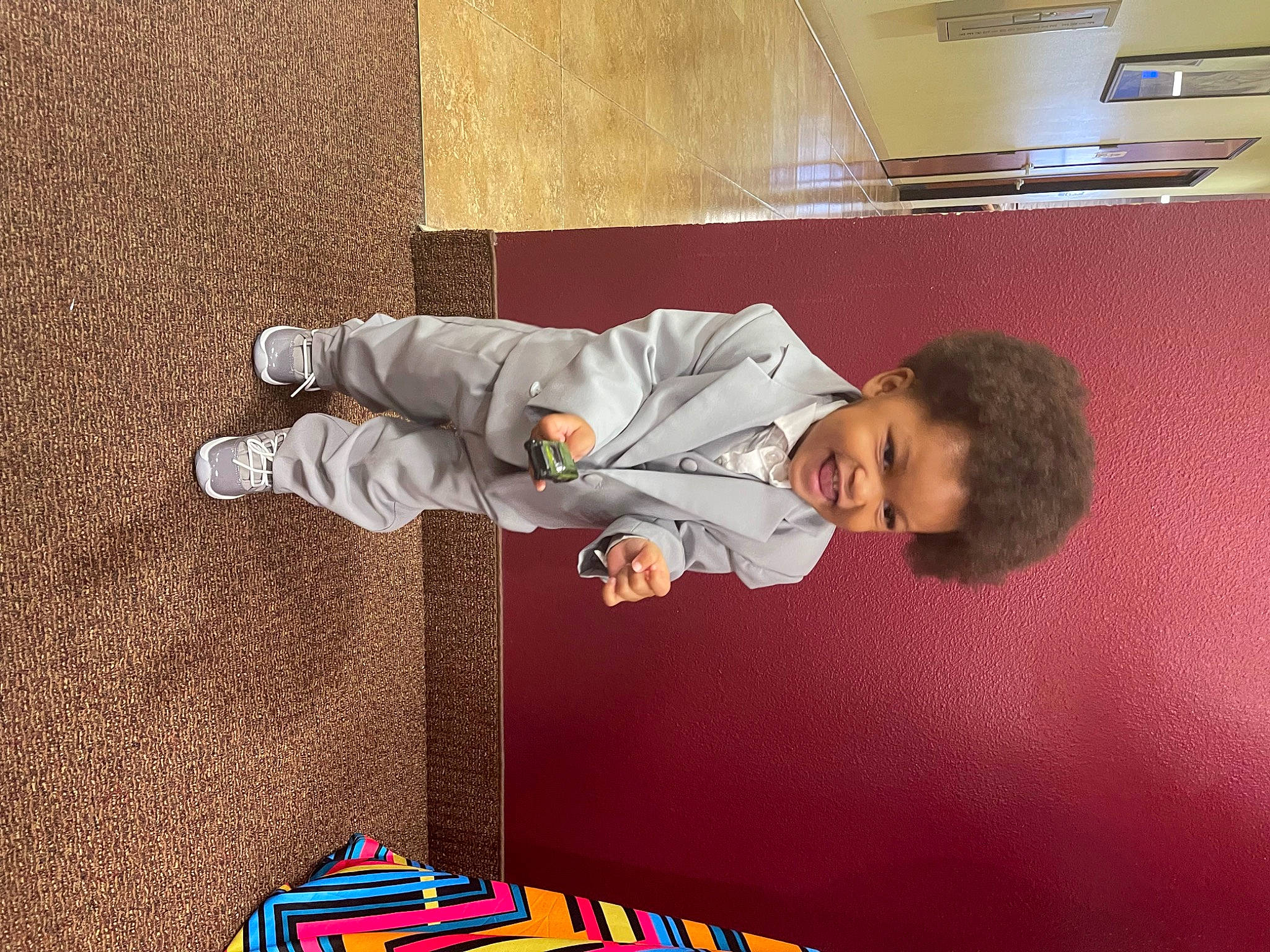 Legend is registered to the contest to win money with this photo: baby, baby_toddler_clothing, child, comfort, flooring, fun, leisure, person, play, room, sitting, space, toddler, walking_shoe