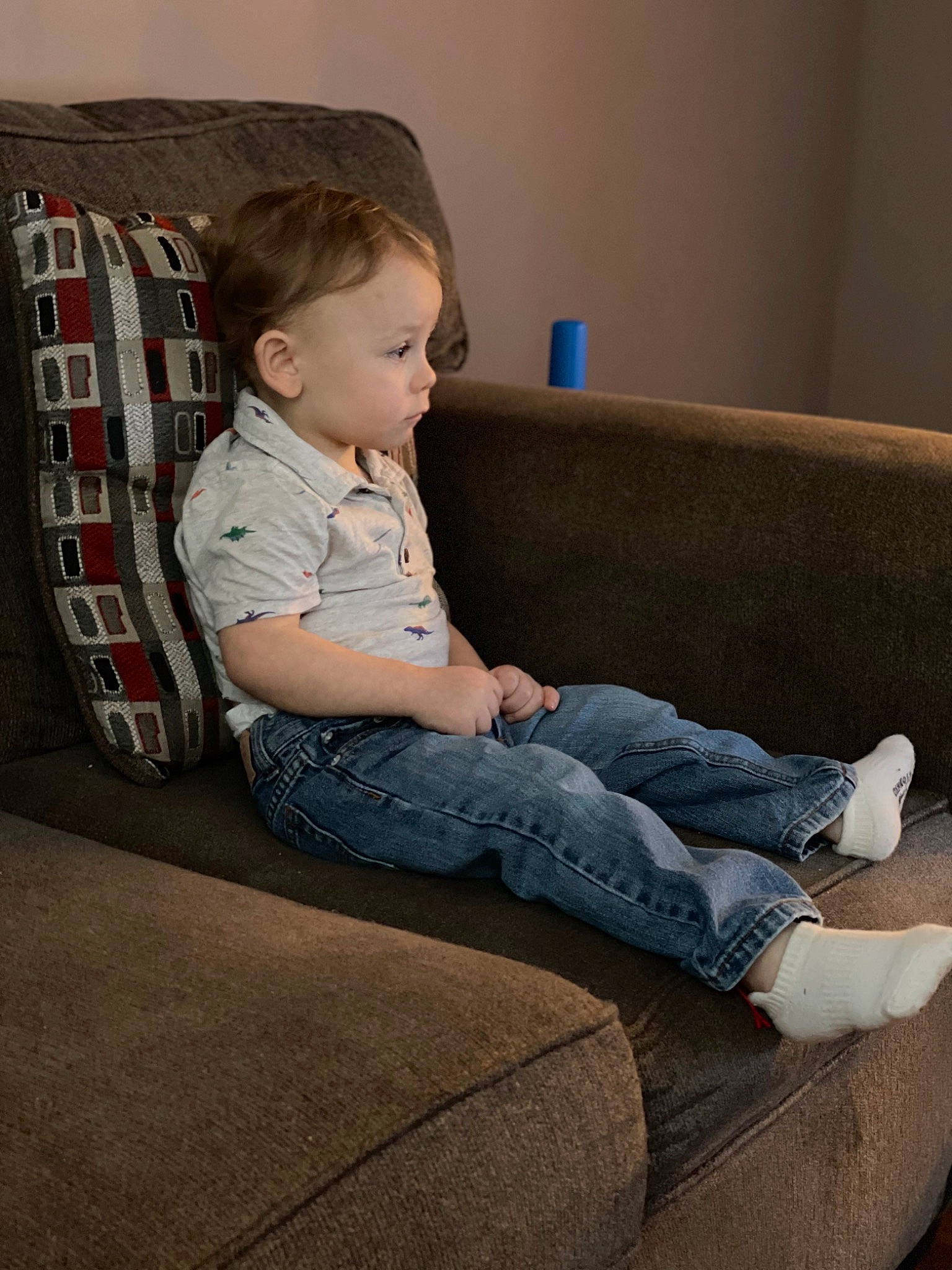 Holden is registered to the contest to win money with this photo: baby_toddler_clothing, child, comfort, couch, elbow, electric_blue, eye, floor, flooring, human_leg, knee, lap, leg, person, sitting, sleeve, studio_couch, t_shirt, thigh, toddler