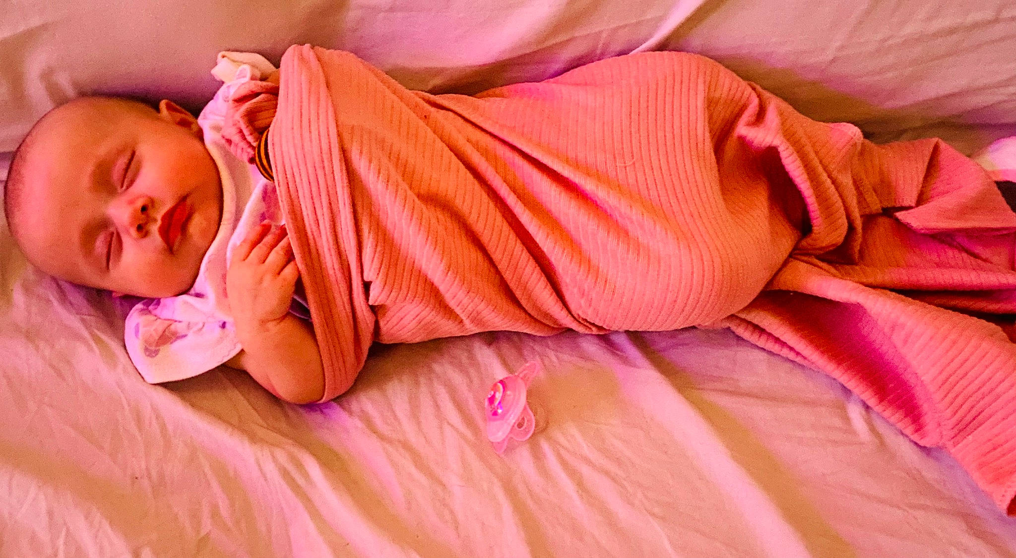 Annalise joined the competition — help win amazing prizes! arm, baby_sleeping, baby_toddler_clothing, comfort, couch, dress, eye, eyelash, hand, human_body, leg, linens, lip, mouth, nail, neck, orange, person, pink, skin
