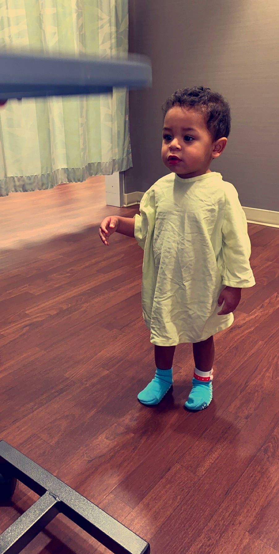 Javen is registered to the contest to win money with this photo: baby, child, floor, flooring, fun, hardwood, human, joint, person, play, shoe, shoulder, skin, smile, standing, toddler, wood, wood_flooring