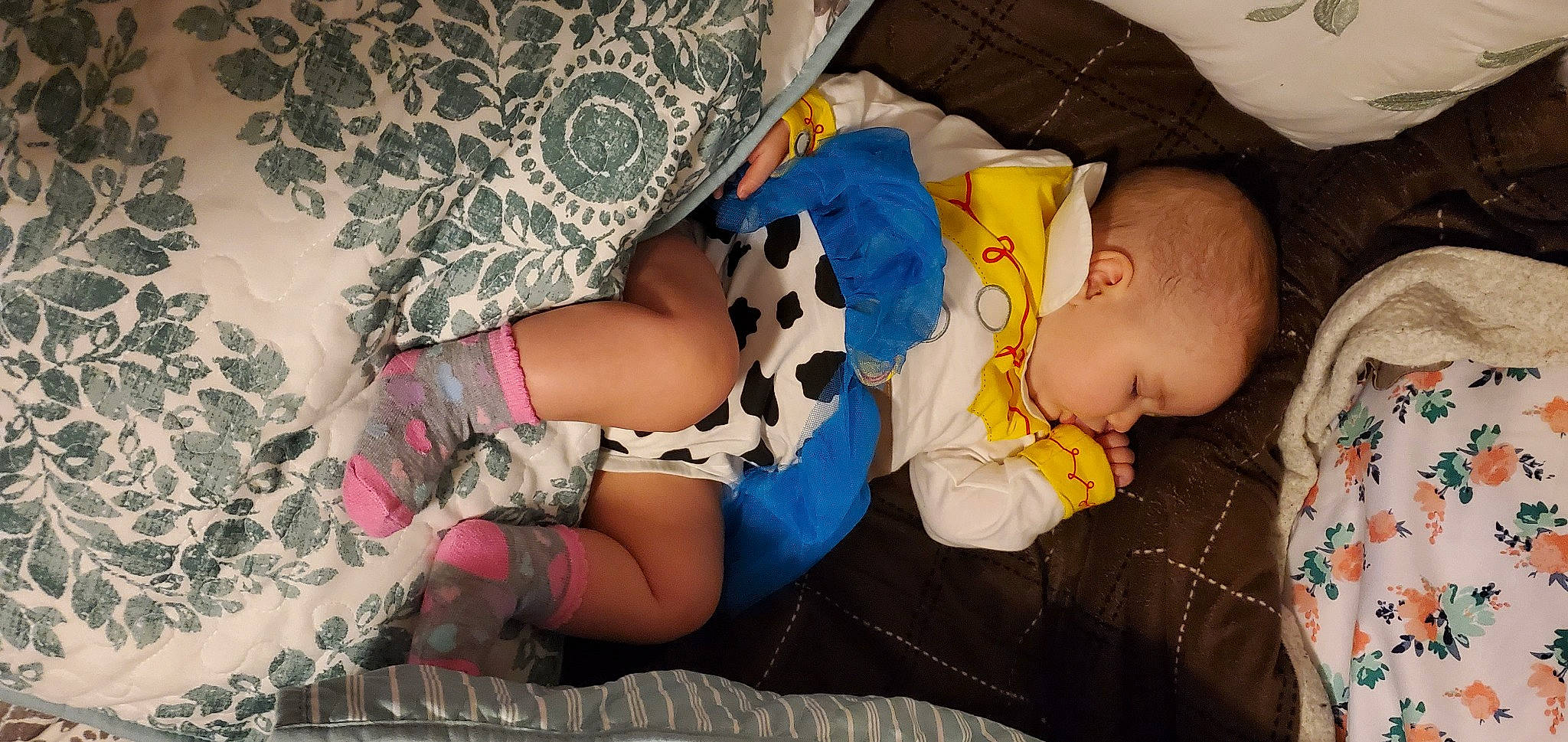 Eleanor joined the competition — help win amazing prizes! arm, baby, baby_sleeping, baby_toddler_clothing, child, comfort, couch, finger, fun, hand, human_leg, lap, leg, linens, pattern, person, room, sitting, textile, thigh