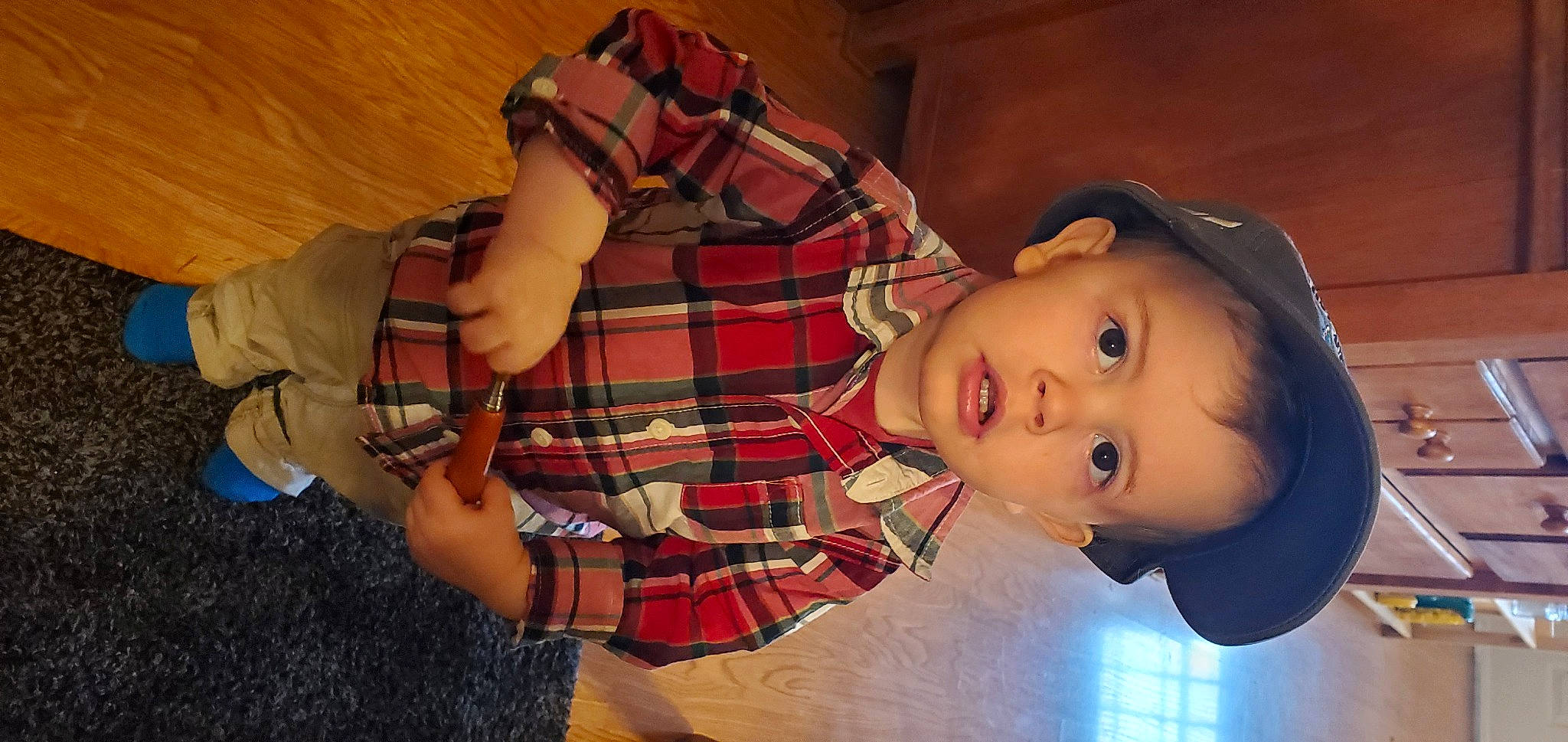 Dean is registered to the contest to win money with this photo: bag, child, elbow, fashion_accessory, fun, happy, hat, nail, pattern, person, plaid, sitting, tartan, textile, thumb, toddler, toy, wrist