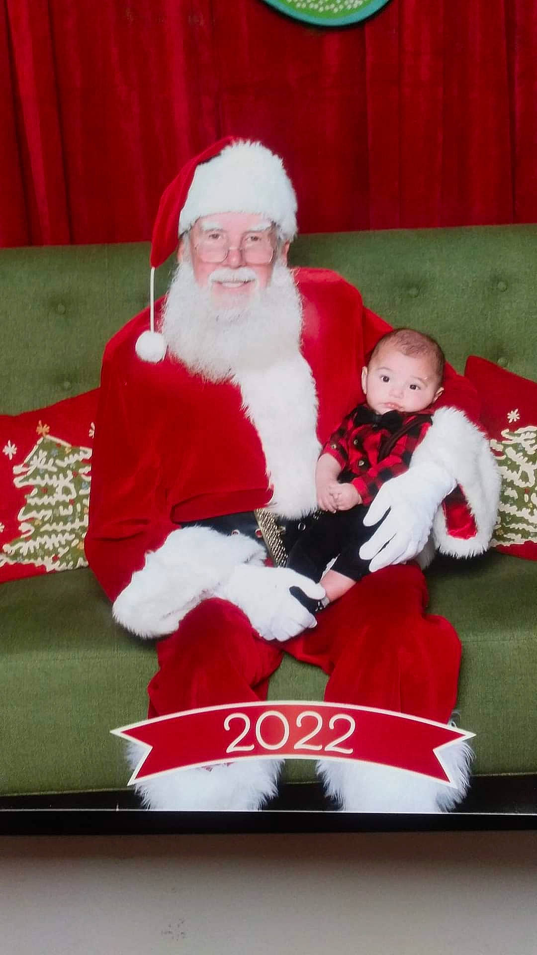 Andrew joined the competition — help win amazing prizes! baby, carmine, christmas, christmas_decoration, christmas_eve, comfort, costume_hat, curtain, event, face, fictional_character, fur, headwear, holiday, human_body, lap, person, santa_claus, sitting, smile