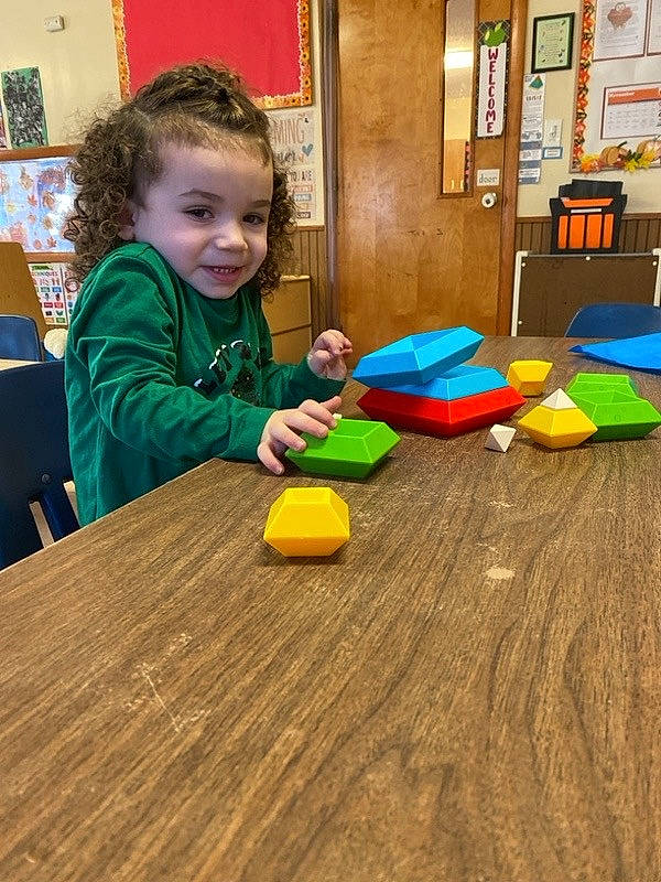 Riley joined the competition — help win amazing prizes! chair, child, floor, flooring, fun, happy, hardwood, kindergarten, leisure, person, play, plywood, sitting, smile, table, toddler, toy, varnish, wood, wood_flooring