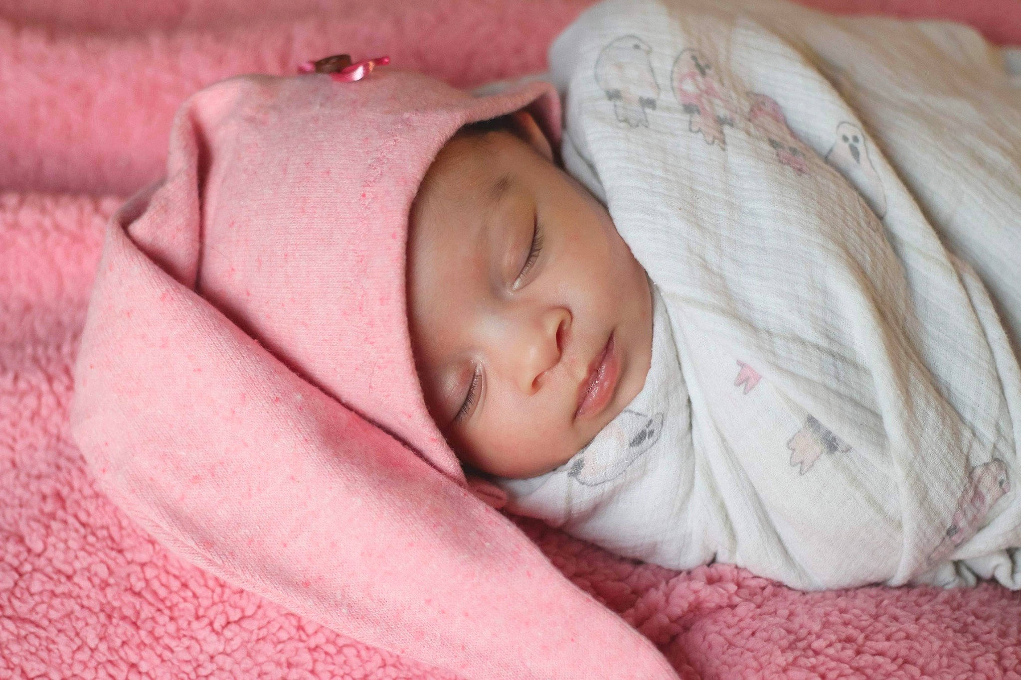 Kailani is registered to the contest to win money with this photo: baby, baby_sleeping, baby_toddler_clothing, cheek, child, comfort, eye, eyebrow, face, hand, hat, head, headwear, human_body, iris, linens, nose, person, pink, skin