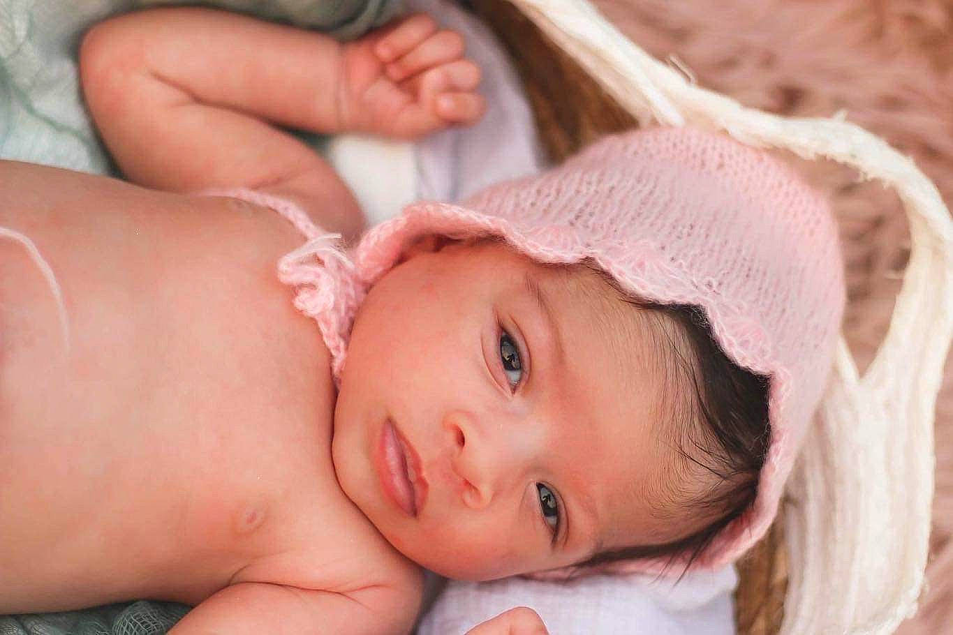 Kailani joined the competition — help win amazing prizes! baby, baby_toddler_clothing, beauty, cheek, chest, child, close_up, eyelash, finger, grass, happy, head, headband, headpiece, human_body, lip, nose, person, pink, skin