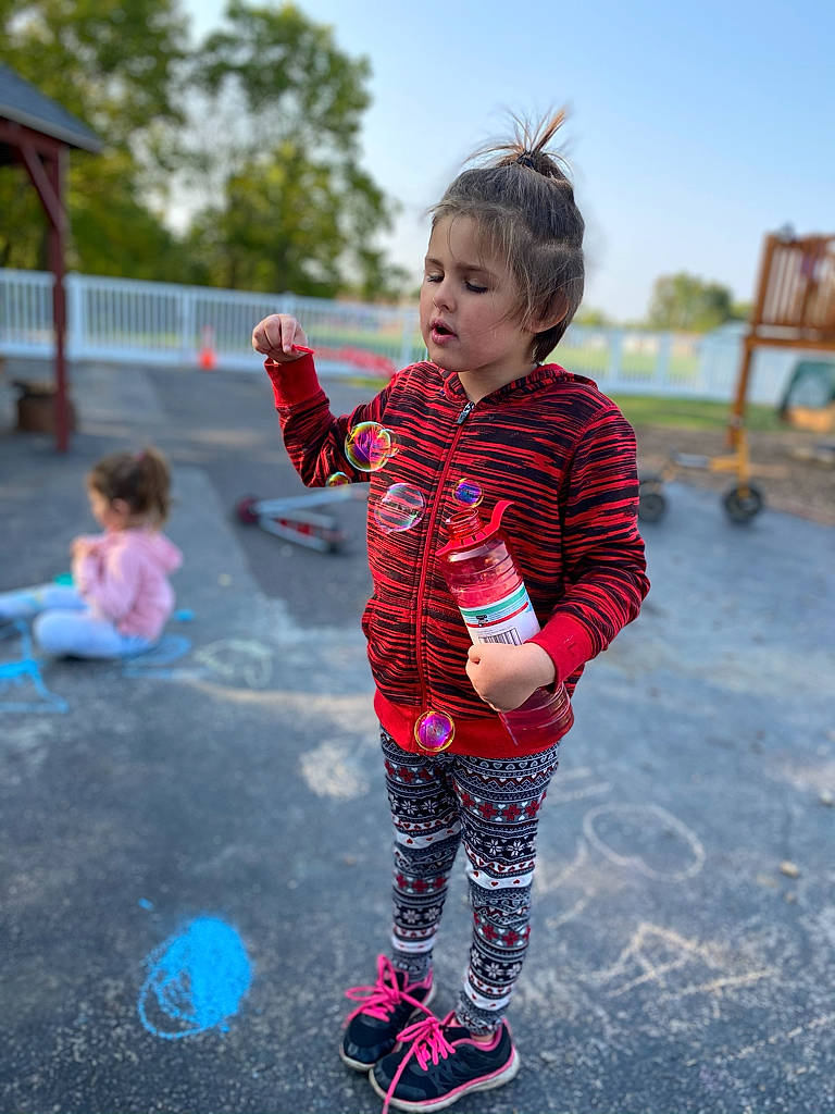 Riley is registered to the contest to win money with this photo: child, face, footwear, fun, games, happy, leisure, people, person, pink, plant, play, playground, recreation, red, skin, smile, toddler, vacation, water