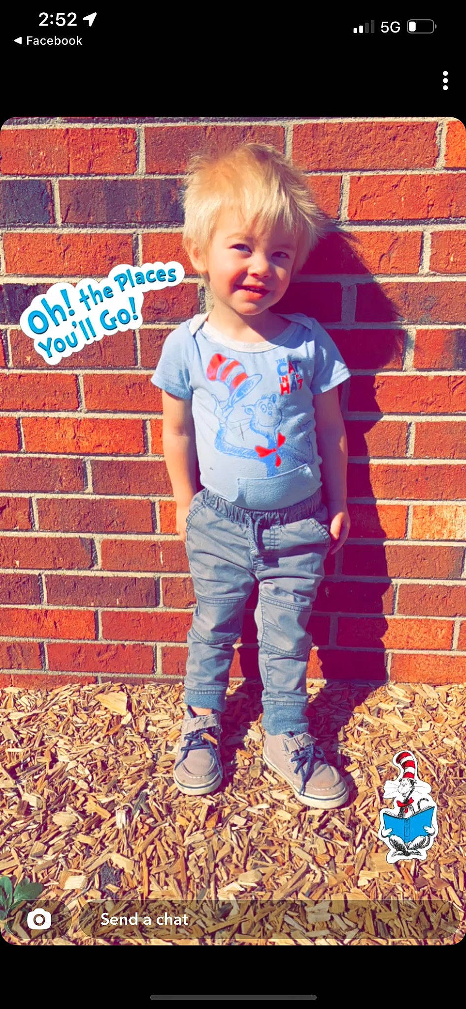 Kolton is registered to the contest to win money with this photo: baby_toddler_clothing, blue, brick, brickwork, clothing, denim, facial_expression, hairstyle, happy, head, human, jeans, joy, mammal, orange, outerwear, people_in_nature, person, sleeve, smile