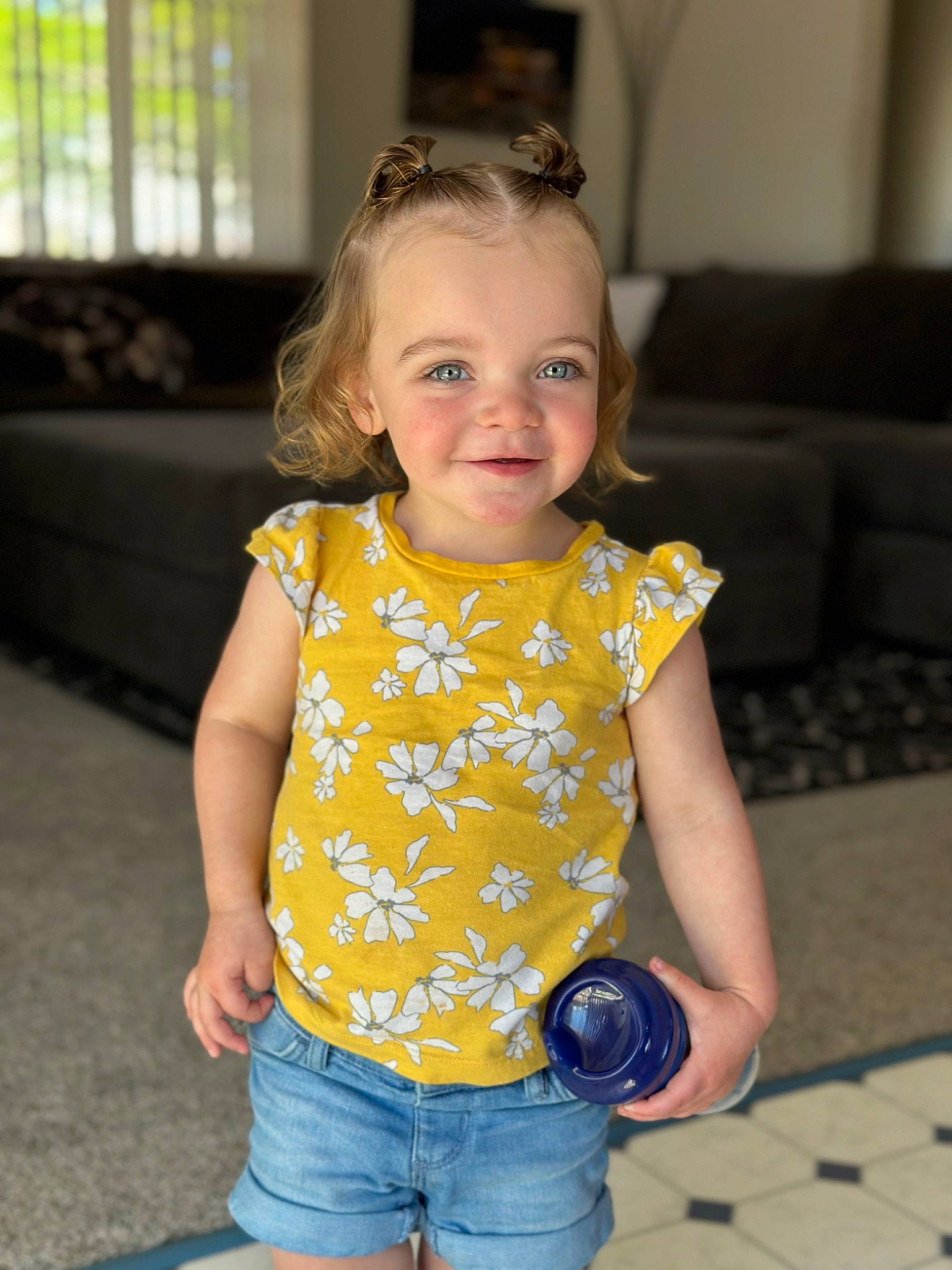 Lila is registered to the contest to win money with this photo: baby_toddler_clothing, cheek, child, cool, eye, finger, fun, hairstyle, happy, head, iris, jean_short, joy, organ, person, photograph, shorts, skin, sleeve, smile