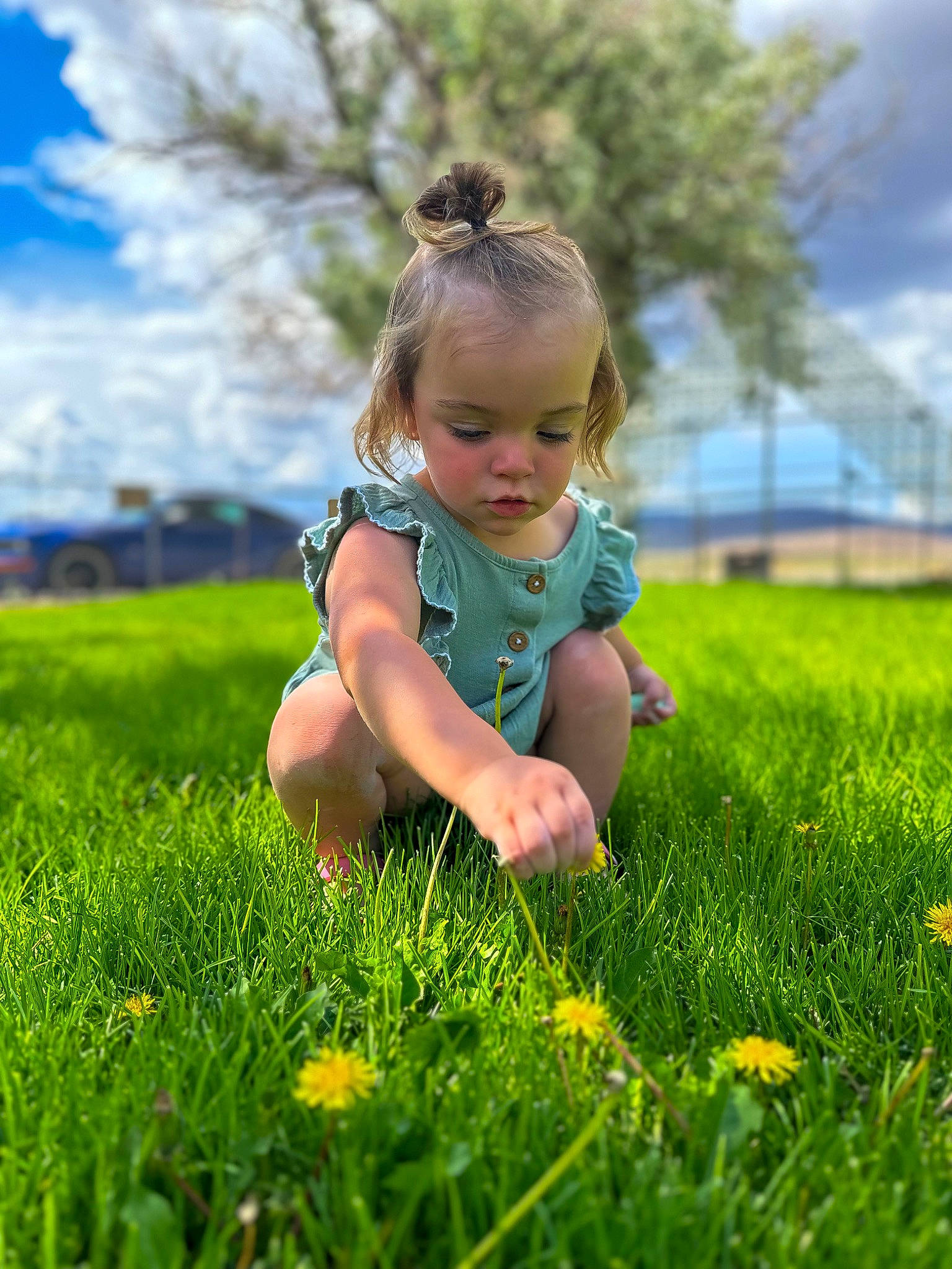 Lila is registered to the contest to win money with this photo: baby, baby_toddler_clothing, child, cloud, electric_blue, flower, grass, grass_family, grassland, happy, landscape, lawn, leisure, meadow, natural_landscape, people_in_nature, person, plant, prairie, sky