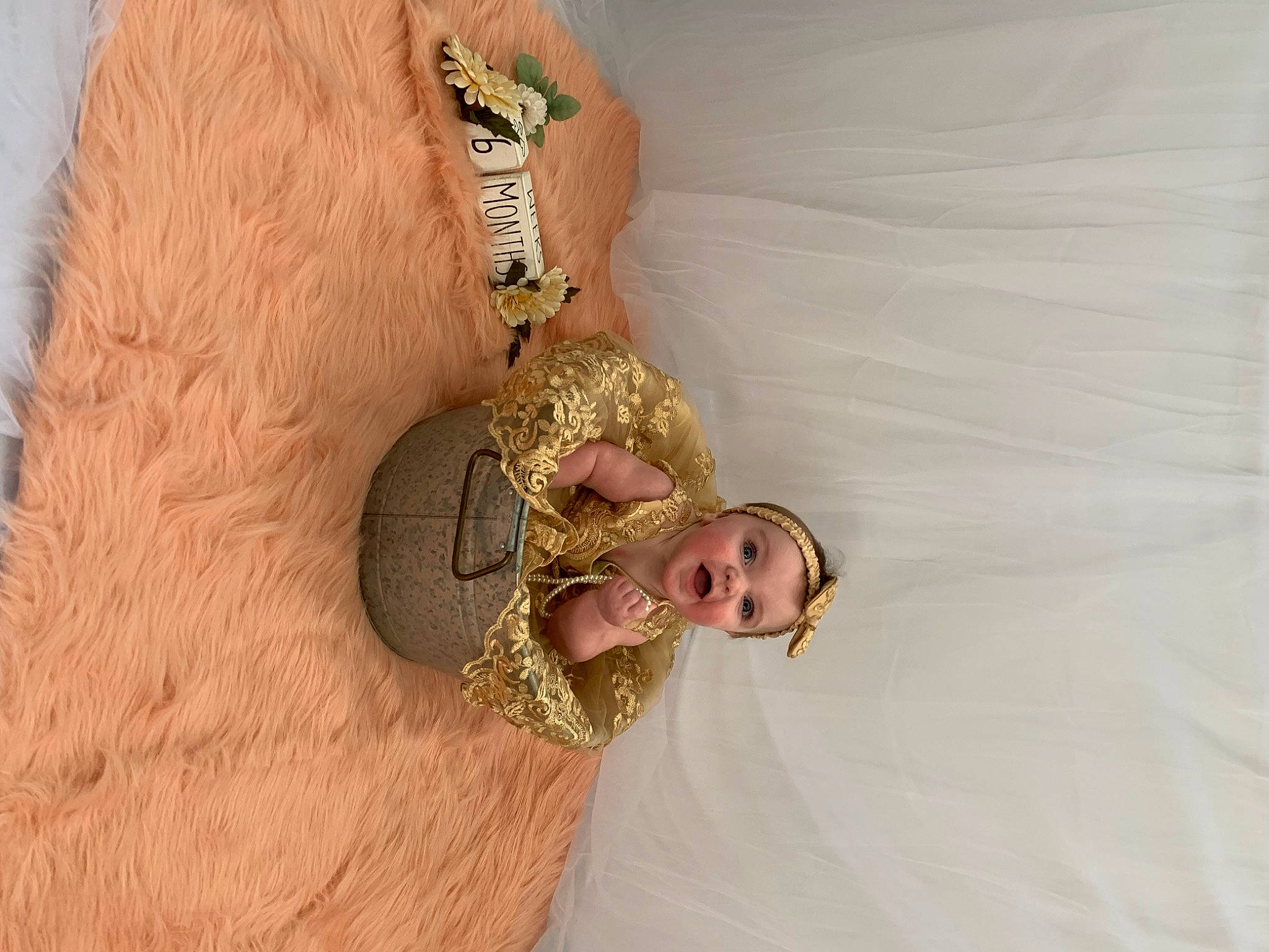 Lila is registered to the contest to win money with this photo: abdomen, bridal_accessory, comfort, eye, fashion_accessory, fashion_design, gesture, hair_accessory, happy, headband, headpiece, human_body, jewellery, linens, pattern, peach, person, sleeve, trunk, wood