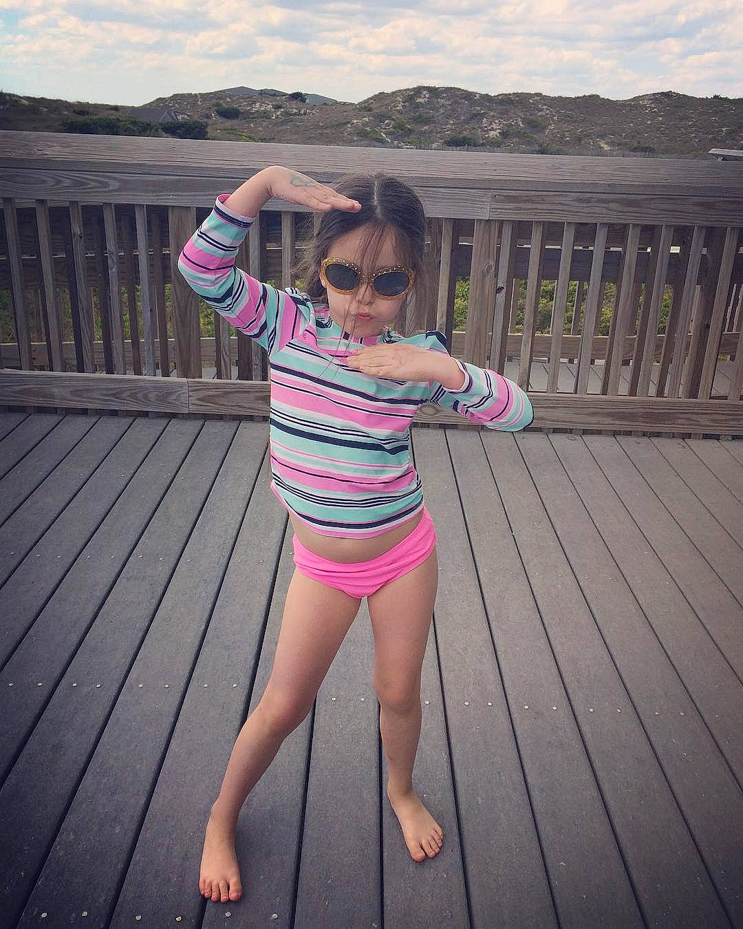 Stefani joined the competition — help win amazing prizes! barefoot, cloud, cool, eyewear, flash_photography, gesture, goggles, grass, happy, knee, leisure, neck, person, pink, sky, sleeve, sportswear, standing, sunglasses, thigh