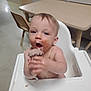 toddler, child, high_chair, chocolate, cupcake, messy, face, hands, table, chair, indoor, eating, food, happy, baby, mouth_open, dining_room, skin, person, cute