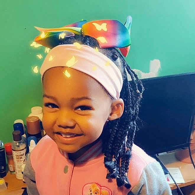Myah is registered to the contest to win money with this photo: black_hair, cap, cheek, child, chin, cool, ear, eye, eyebrow, face, fashion_accessory, forehead, hair_accessory, hair_coloring, hairstyle, head, headgear, headwear, joy, person
