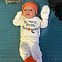 Aubrey is registered to the contest to win money with this photo: baby, infant, halloween, costume, orange_hat, orange_booties, white_clothing, lying_down, blue_blanket, patterned_blanket, cute, holiday, celebration, newborn, child, portrait, indoors, soft_toys, cozy, festive