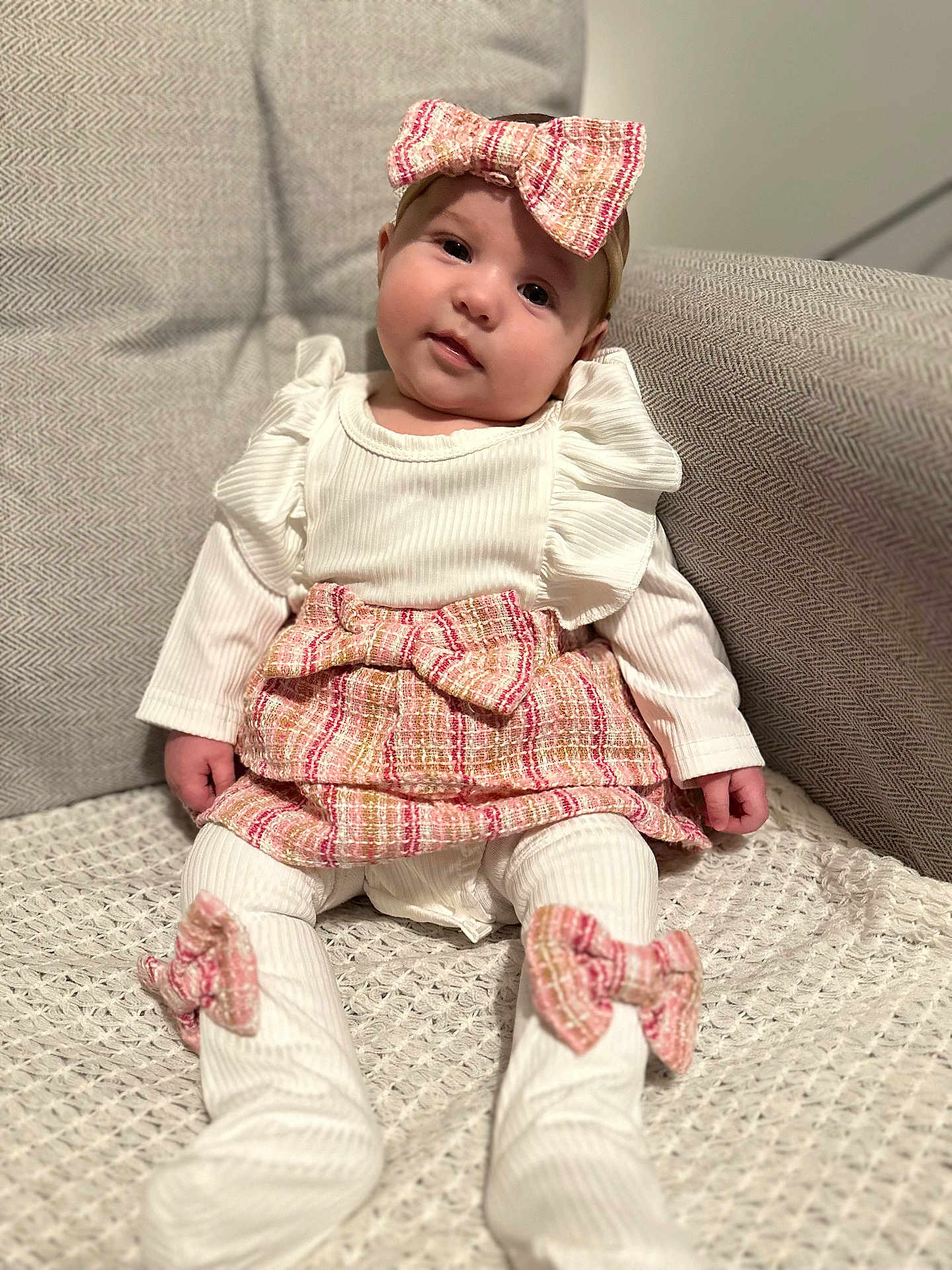 Rose joined the competition — help win amazing prizes! baby, child, infant, bow, headband, white_clothing, sitting, blanket, couch, indoor, portrait, cute, smile, happy, fashion, texture, soft_lighting, girl, person, cozy