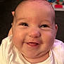 baby, smile, face, infant, white_clothing, closeup, happy, child, portrait, indoors, person, cute, skin, head, eyes, mouth, expression, newborn, young_child, soft_lighting