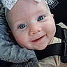 baby, blue_eyes, smile, headband, lace, infant, close_up, face, car_seat, blanket, clothing, cute, child, happy, person, portrait, seatbelt, soft_texture, young, baby_girl