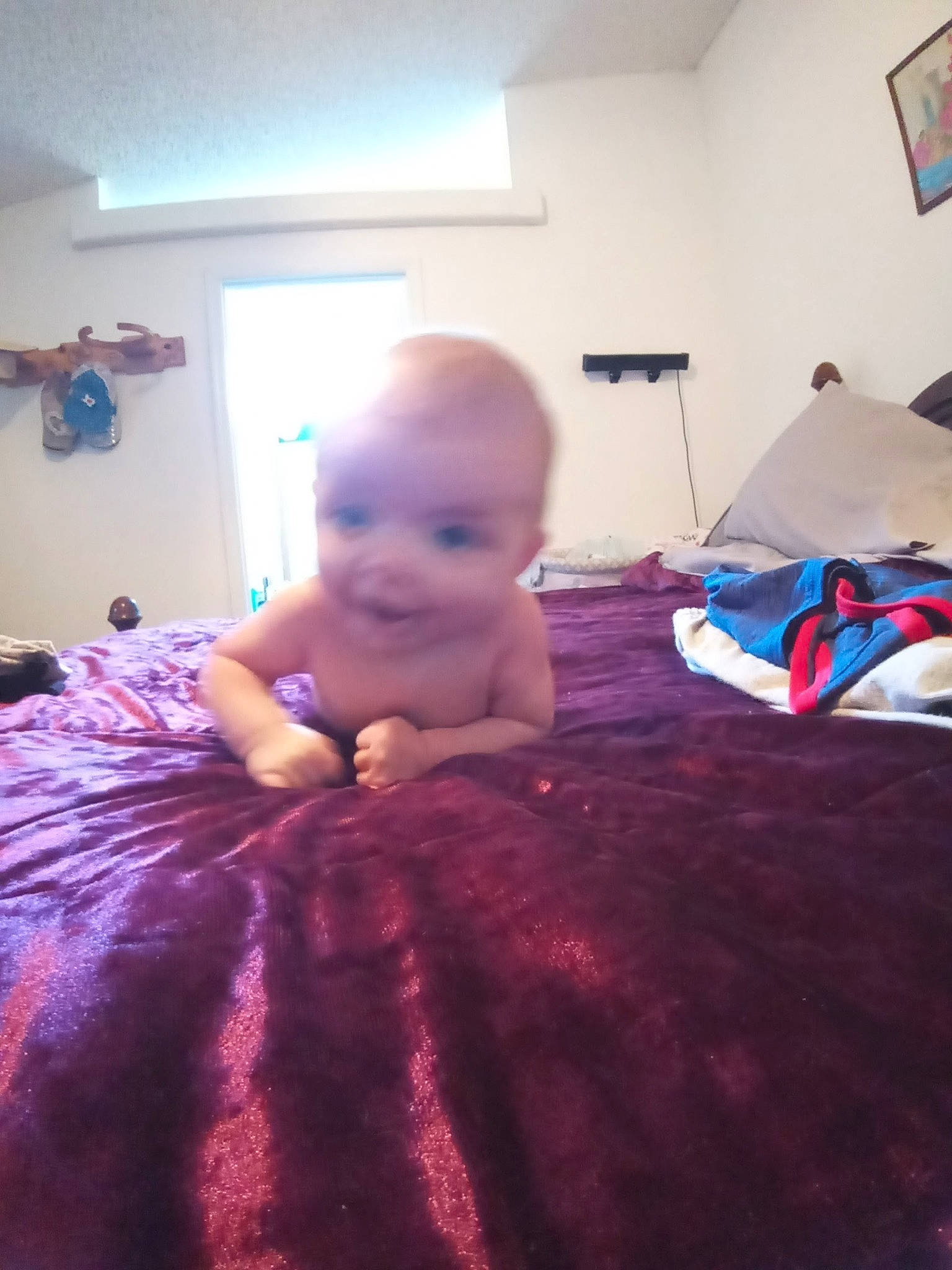 Victoria is registered to the contest to win money with this photo: abdomen, baby, baby_toddler_clothing, blurred, child, comfort, floor, flooring, foot, fun, happy, hardwood, linens, person, picture_frame, room, sitting, skin, thumb, toddler