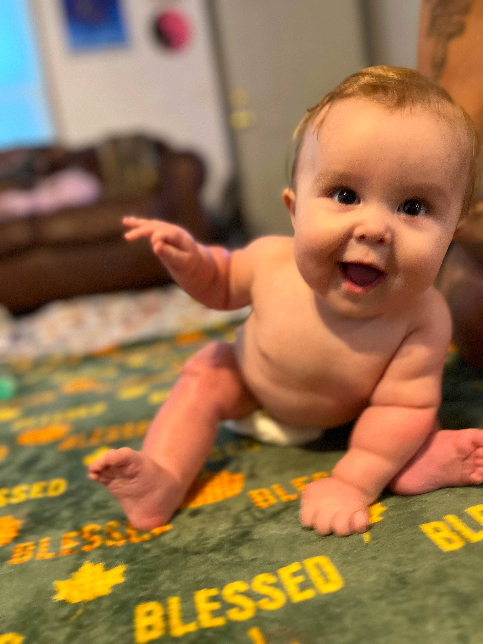 Jackson is registered to the contest to win money with this photo: adaptation, baby, cheek, chest, child, finger, floor, flooring, foot, fun, hand, happy, mouth, nose, person, room, skin, smile, thumb, toddler