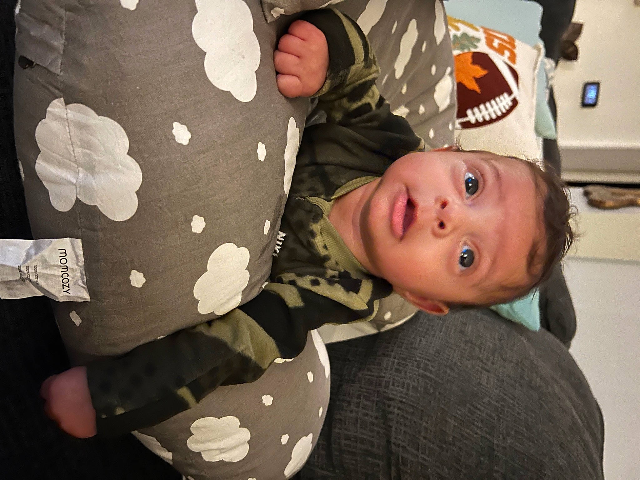 Angelo joined the competition — help win amazing prizes! baby, baby_products, baby_toddler_clothing, child, comfort, elbow, happy, linens, pattern, person, room, sitting, sleeve, t_shirt, toddler, tree, wood