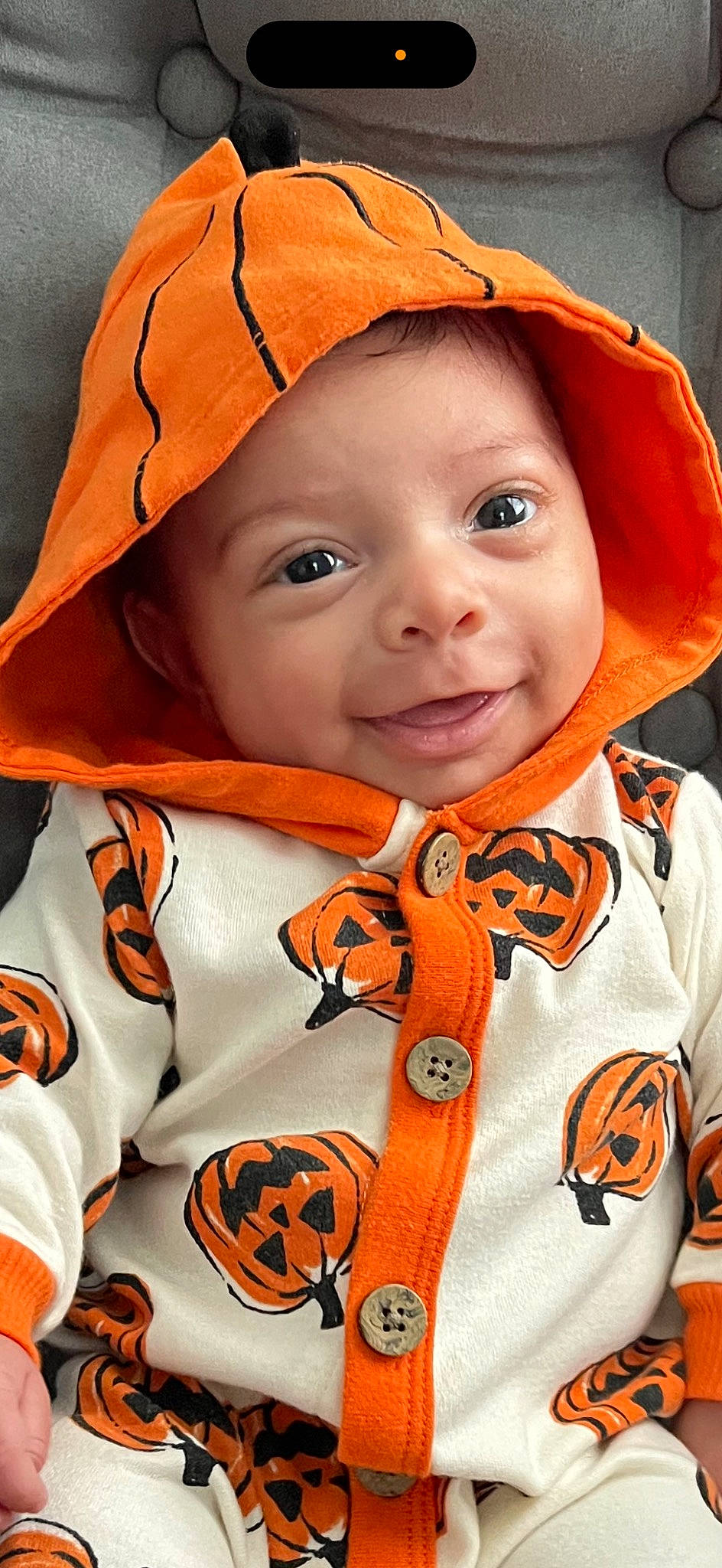 Angelo is registered to the contest to win money with this photo: cheek, chin, clothing, eye, eyebrow, face, facial_expression, head, headwear, lip, mouth, nose, orange, organ, outerwear, person, product, skin, sleeve, smile