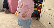 Vada joined the competition — help win amazing prizes! bunny, cabinet, carpet, child, curtain, cute, face, floor, furniture, hair, indoor, person, playroom, skirt, smile, sock, sweater, toddler, toy, window