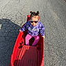 Vada joined the competition — help win amazing prizes! child, toddler, sunglasses, purple_sweatshirt, pink_leggings, red_wagon, outdoor, pavement, shadow, person, hair_buns, sunlight, toy, road, casual_clothing, play, fun, daytime, cool, accessory