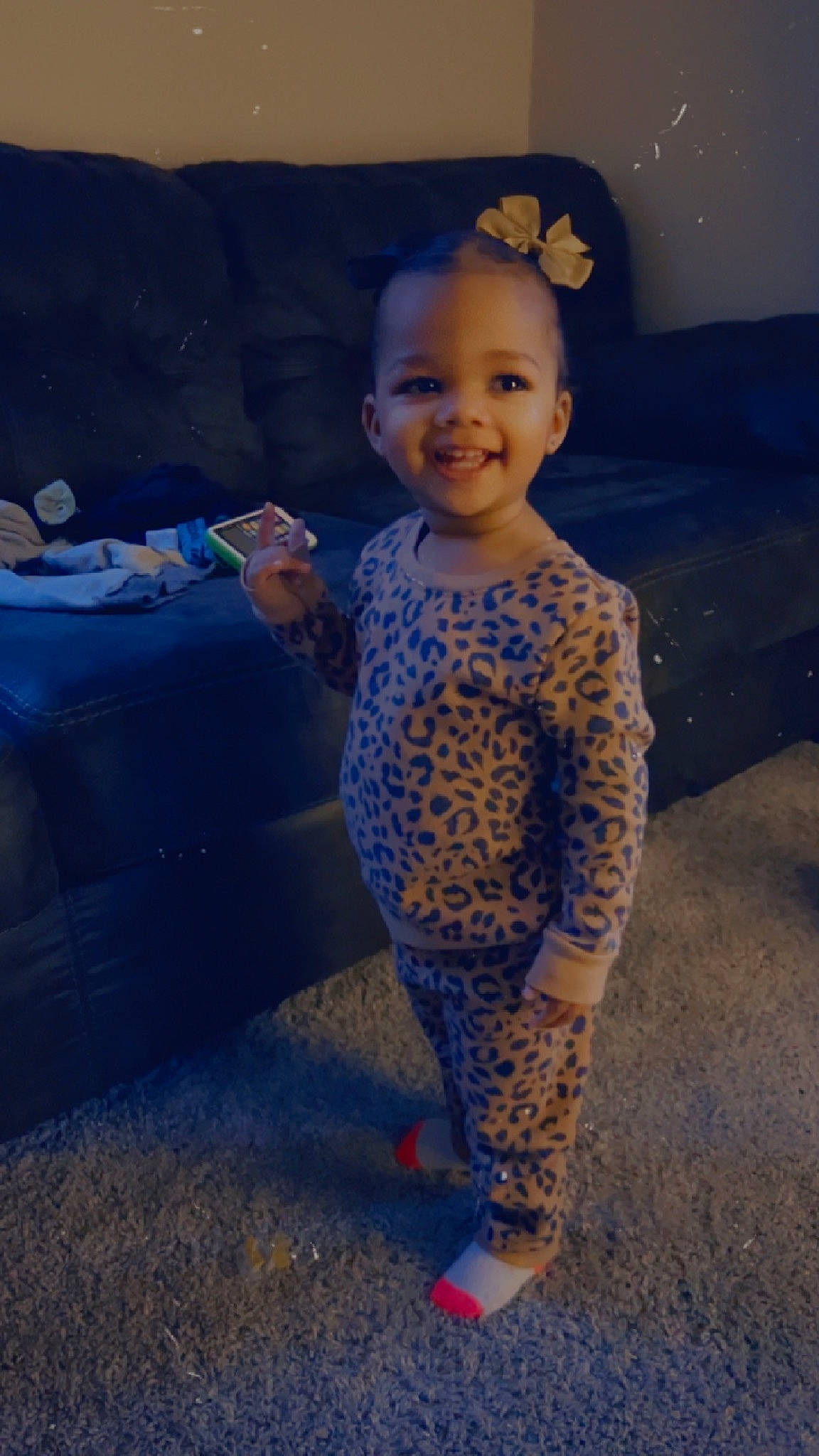 Savanna is registered to the contest to win money with this photo: baby, baby_toddler_clothing, child, electric_blue, eye, flooring, foot, fun, happy, head, human_leg, joy, pattern, person, play, sitting, sleeve, smile, standing, thumb