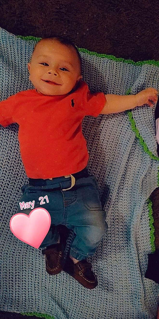 Bostyn is registered to the contest to win money with this photo: arm, baby, baby_products, baby_toddler_clothing, cheek, child, jeans, joy, leg, person, pink, product, sitting, skin, smile, textile, toddler