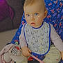 Ambre participe au concours pour gagner de l'argent avec cette photo : baby, child, blue_eyes, bib, toy, chair, indoors, blanket, cushion, foot, hand, face, person, clothing, sitting, expression, cute, comfort, infant, colorful