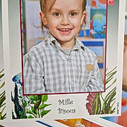 Diego participe au concours pour gagner de l'argent avec cette photo : child, smiling, portrait, indoor, clothing, shirt, hair, face, eyes, background, artwork, colorful, school, photograph, paper, table, decorative, plants, illustration, happy