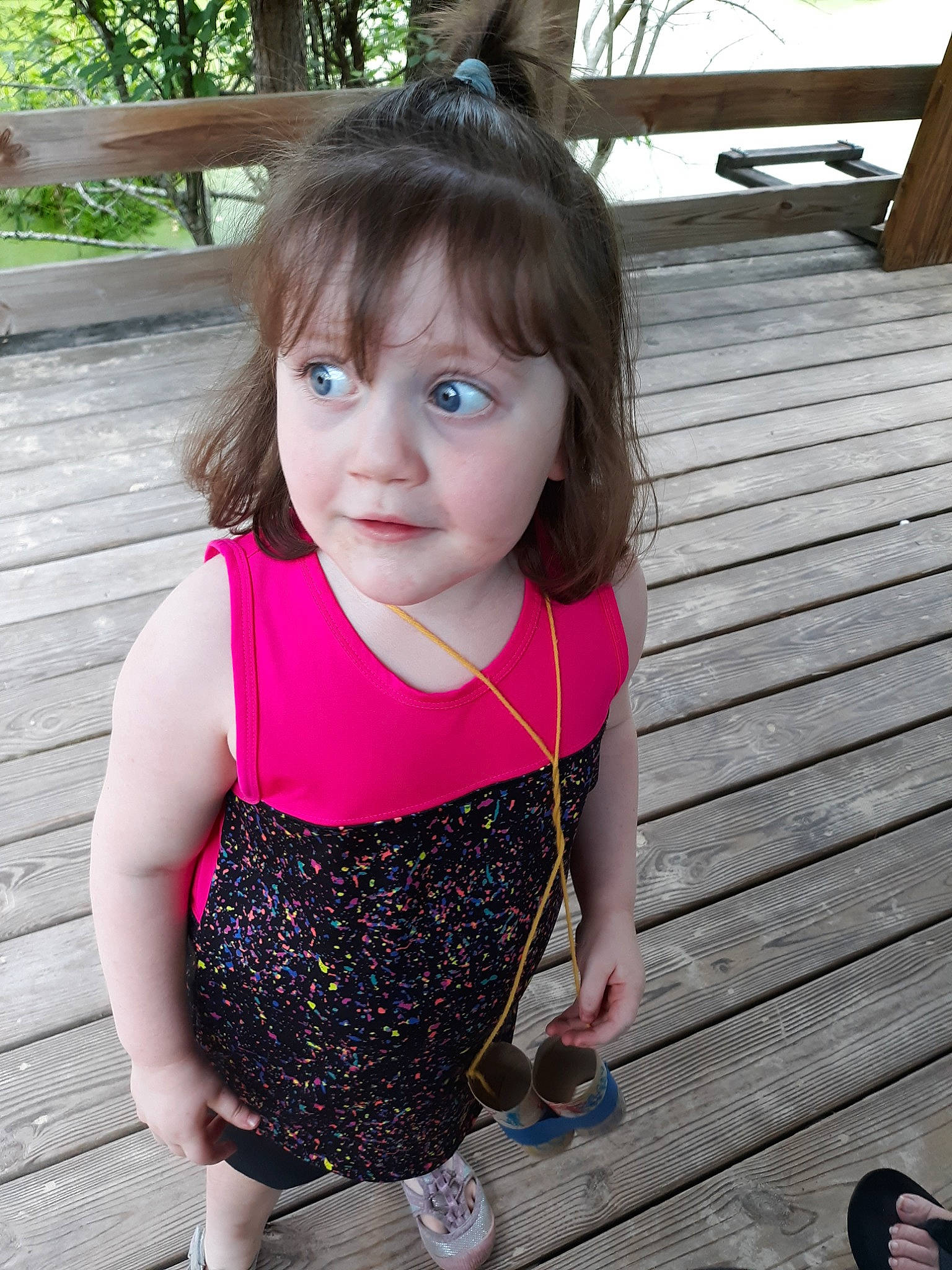 Elouise is registered to the contest to win money with this photo: brown_hair, child, child_model, dress, face, fawn, hair, hairstyle, pattern, person, pink, plant, play, smile, summer, t_shirt, toddler, vacation