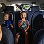 Alazae is registered to the contest to win money with this photo: child, children, car, car_seat, seatbelt, smile, happy, person, woman, vehicle_interior, casual, family, young_child, toddler, clothing, shorts, tshirt, car_window, car_headrest, seat