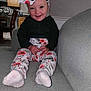 Amara is registered to the contest to win money with this photo: architecture, baby, building, clothing, couch, cushion, face, furniture, head, homedecor, hosiery, indoors, pajamas, pants, person, photography, portrait, scarf, sitting, sock