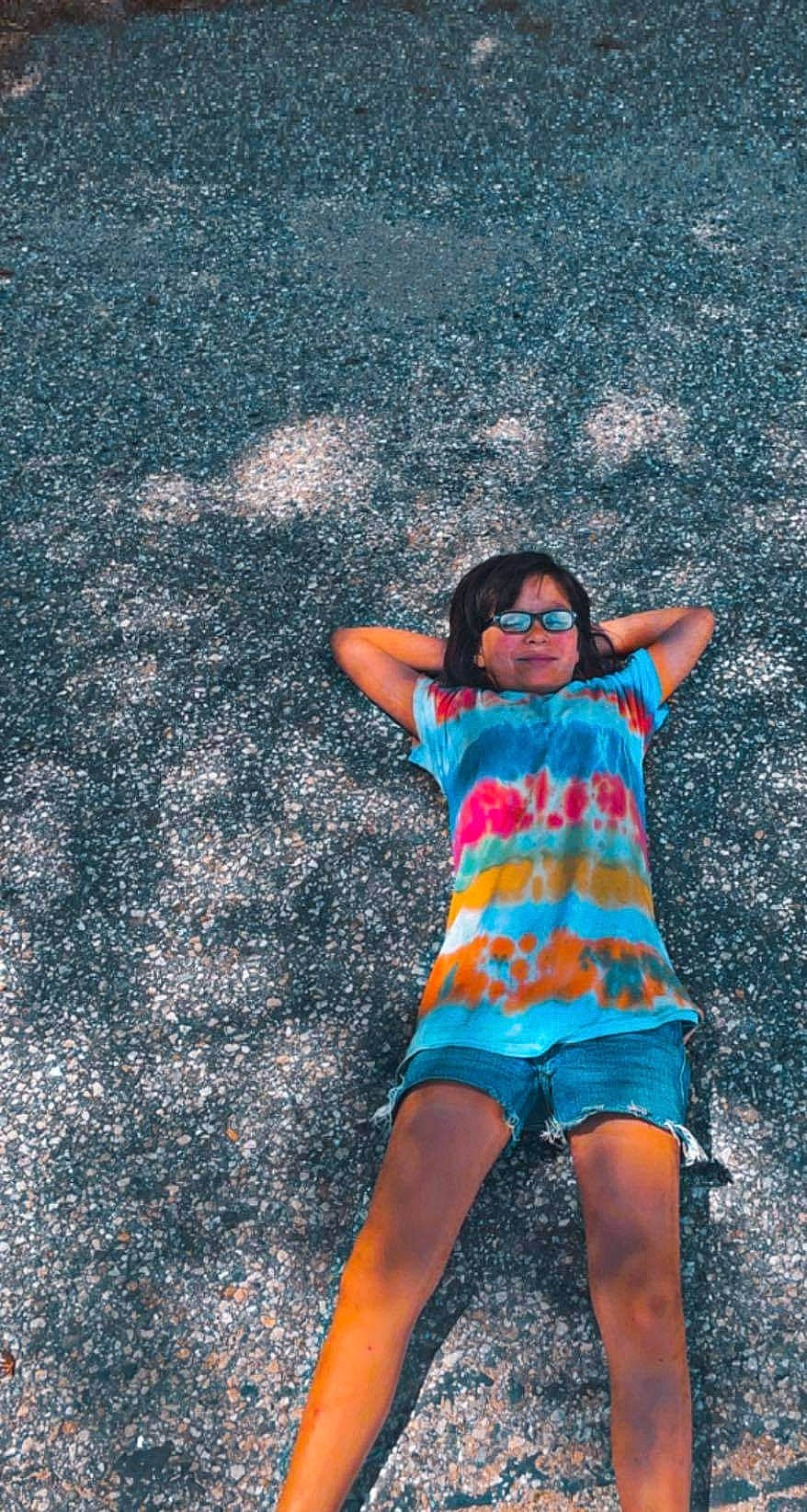 Alexis is registered to the contest to win money with this photo: arm, asphalt, electric_blue, eyewear, flash_photography, grass, happy, head, joy, leg, leisure, people_in_nature, person, road_surface, shorts, summer, sunglasses, t_shirt, thigh, tints_and_shades