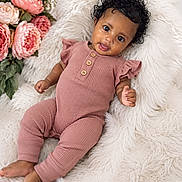 Amaris joined the competition — help win amazing prizes! baby, infant, cute, smiling, pink_outfit, curly_hair, fluffy_blanket, flowers, portrait, child, indoors, relaxing, soft_texture, wooden_buttons, happy, lying_down, skin, natural_light, cozy, peaceful