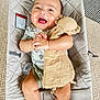 baby, smiling, infant, baby_seat, toy, pacifier, clothing, carpet, fabric, hand, face, cute, child, indoor, person, seat, happy, soft_toy, lying_down, blanket