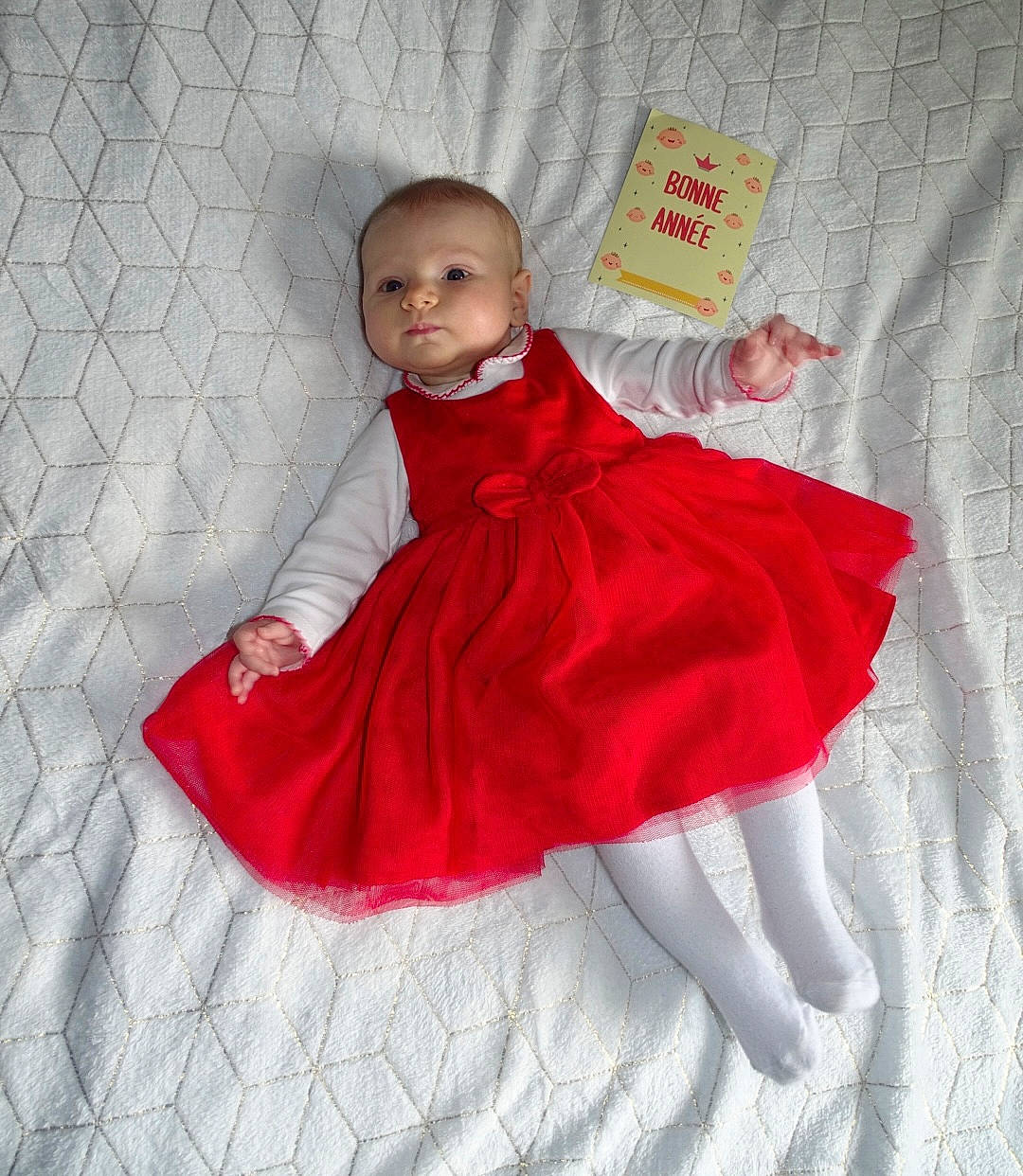 Théa participe au concours pour gagner de l'argent avec cette photo : baby, baby_toddler_clothing, child, day_dress, dress, embellishment, linens, one_piece_garment, pattern, peach, person, pink, ruffle, textile, toddler