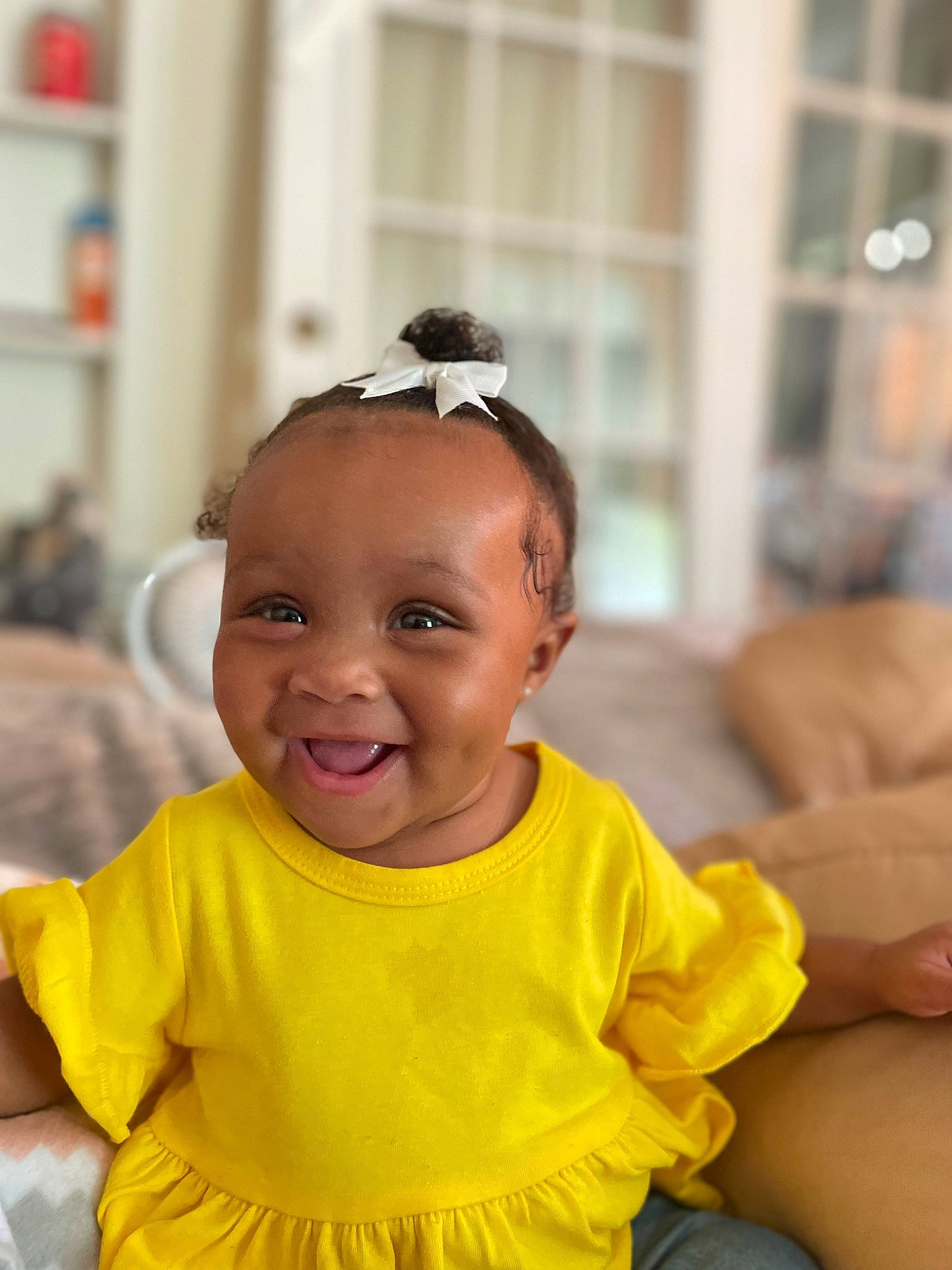 Tayonni is registered to the contest to win money with this photo: audio_equipment, baby, baby_toddler_clothing, cheek, child, event, eyewear, face, fun, goggles, happy, iris, joy, leisure, person, room, sitting, skin, smile, sunglasses