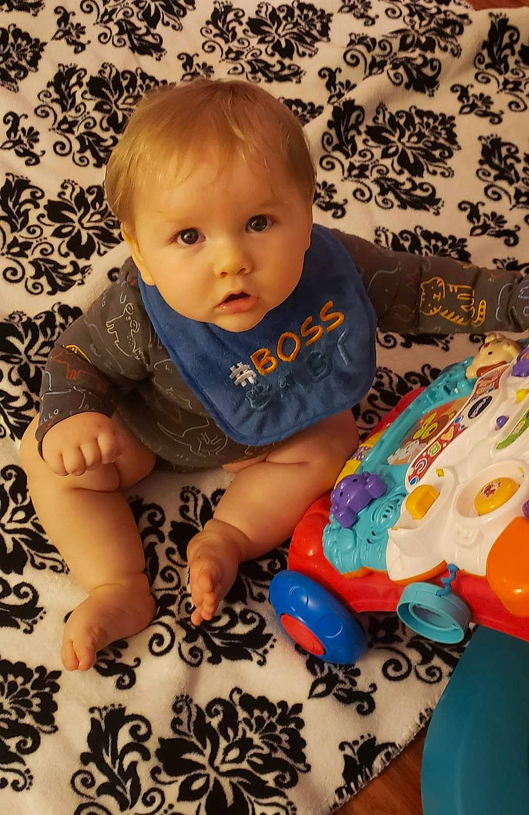 Daylyn Joshua Wayne Godfrey is registered to the contest to win money with this photo: baby, baby_toddler_clothing, beauty, cheek, child, comfort, eye, facial_expression, finger, flooring, head, human, iris, linens, mammal, person, product, skin, sleeve, t_shirt