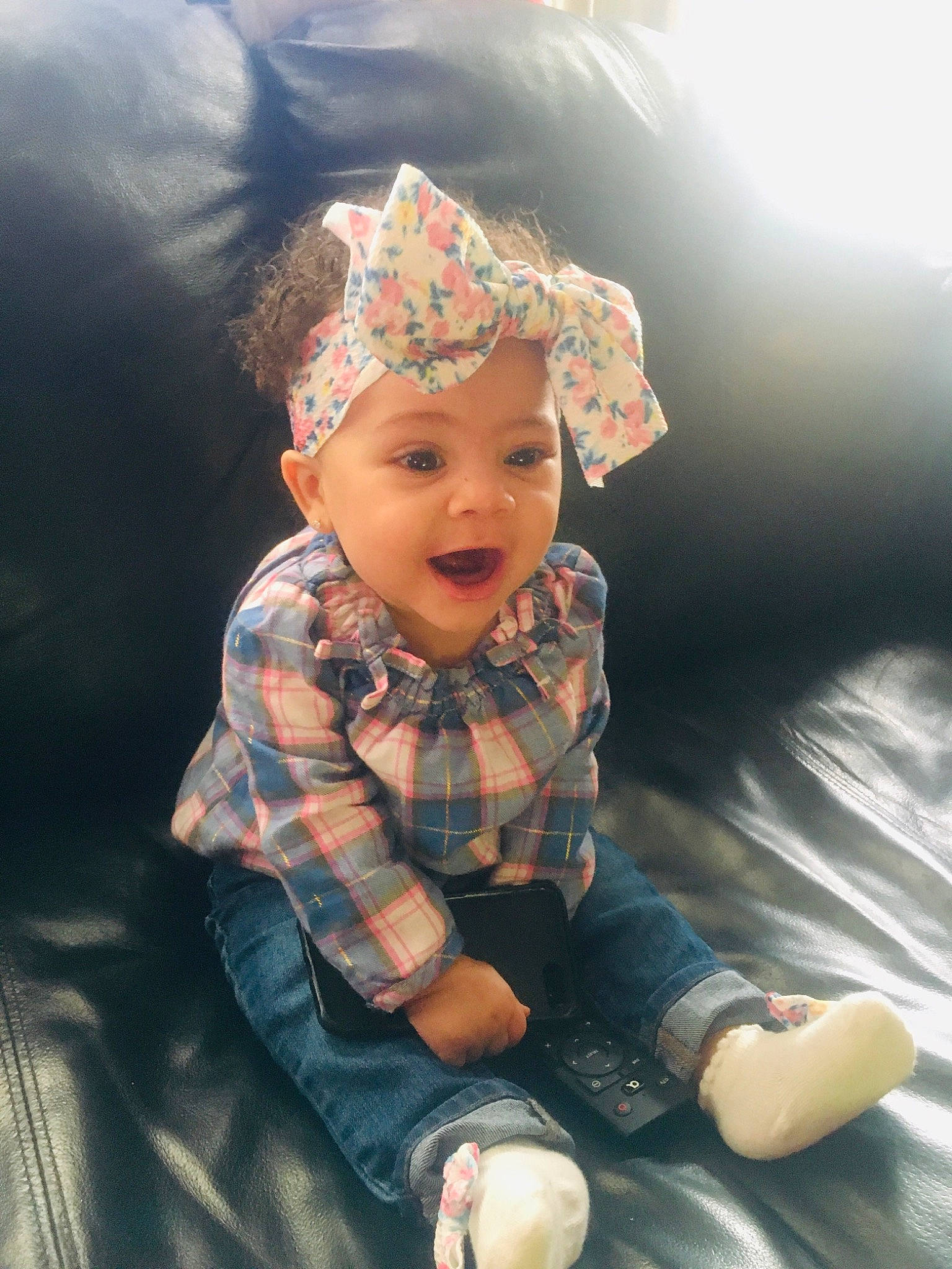 Harmony is registered to the contest to win money with this photo: baby, child, cool, fashion_accessory, fashion_design, flash_photography, fun, grass, happy, hat, headgear, headpiece, headwear, pattern, person, personal_protective_equipment, plaid, sitting, sleeve, smile