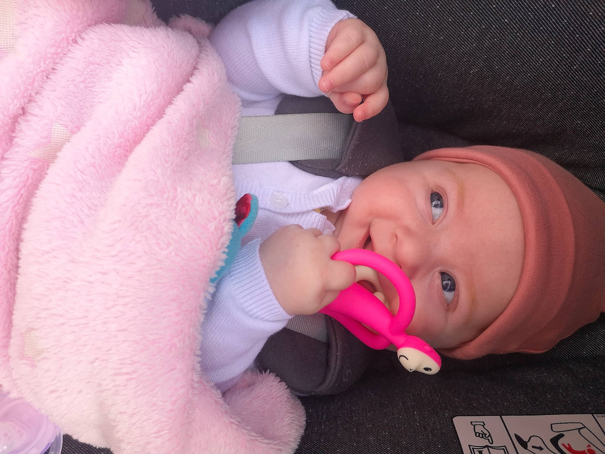 Emma is registered to the contest to win money with this photo: baby, baby_grabbing_for_something, baby_toddler_clothing, cheek, comfort, ear, eyelash, facial_expression, finger, gesture, hand, headwear, iris, lip, mouth, nose, person, pink, product, skin