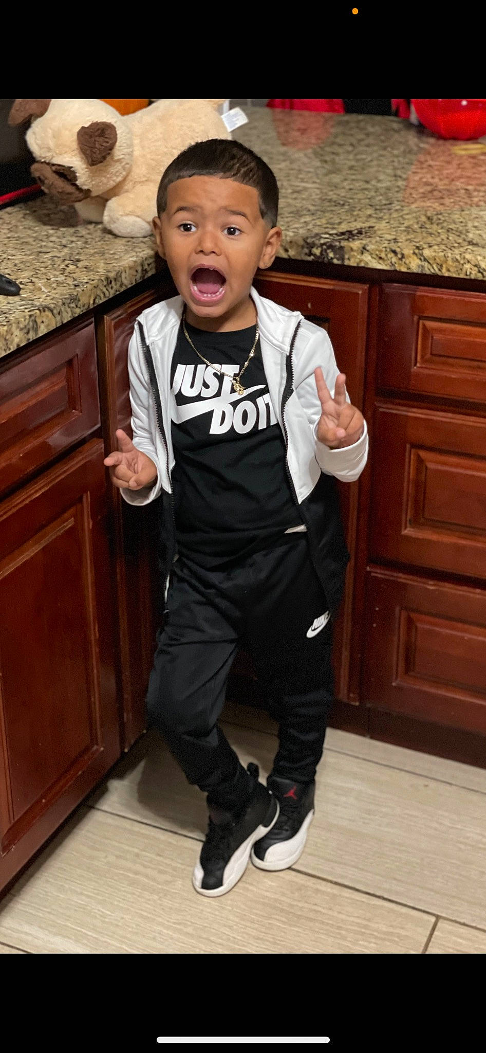 Jalen joined the competition — help win amazing prizes! cabinetry, chest_of_drawers, drawer, flooring, formal_wear, fun, gesture, happy, hardwood, knee, leg, outerwear, person, room, sleeve, sportswear, surprise, t_shirt, thumb, toddler