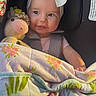 Delilah joined the competition — help win amazing prizes! baby, child, car_seat, headband, bow, crocheted_toy, unicorn, blanket, floral_pattern, smile, cute, infant, seatbelt, pink_clothing, soft_toy, indoors, portrait, happy, young_child, comfort