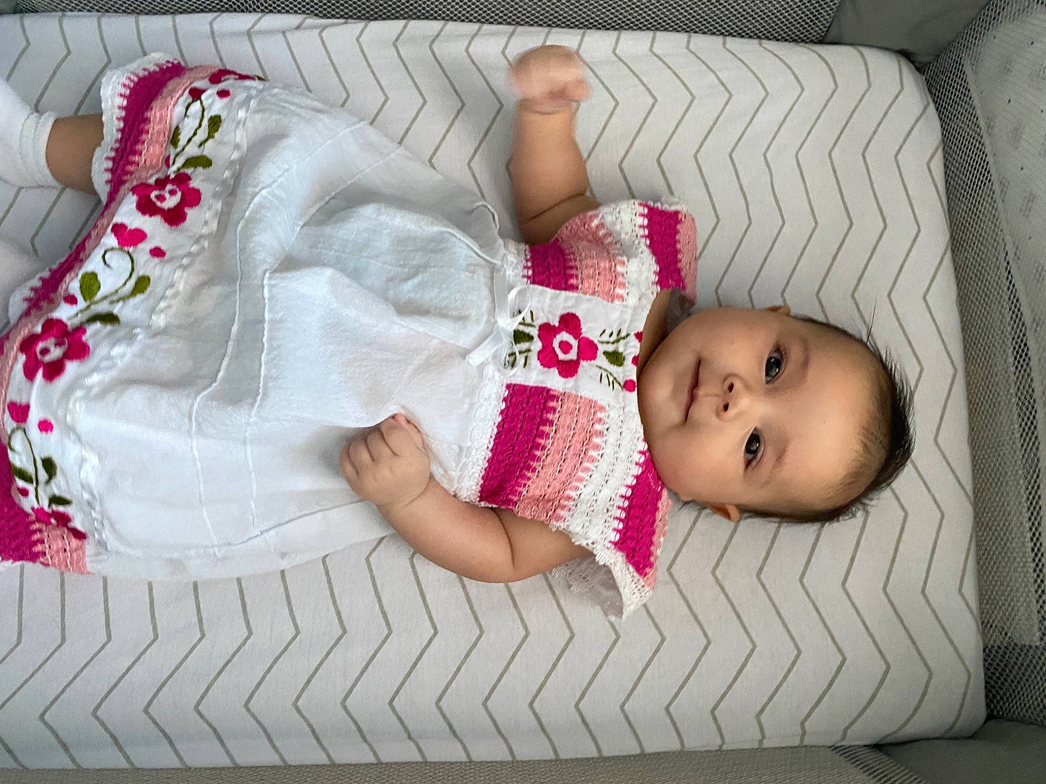 Zelda is registered to the contest to win money with this photo: baby, baby_products, baby_toddler_clothing, bedding, bedtime, child, comfort, dress, flooring, head, headgear, leg, linens, pattern, person, pink, skin, sleeve, textile, toddler