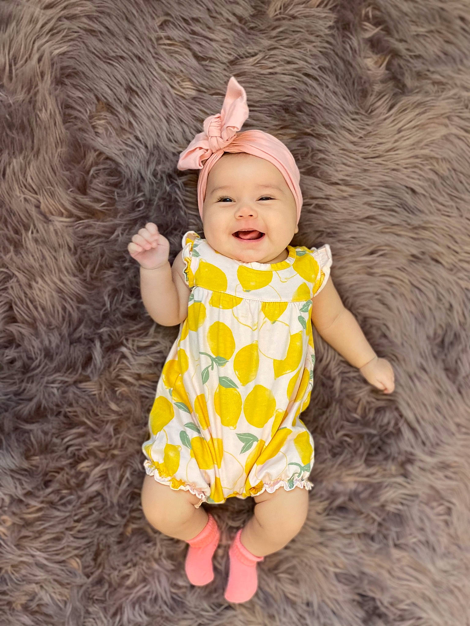 Zelda is registered to the contest to win money with this photo: baby, baby_toddler_clothing, beauty, day_dress, dress, face, fun, grass, happy, head, headwear, human_body, joy, one_piece_garment, pattern, people_in_nature, person, pink, skin, sleeve
