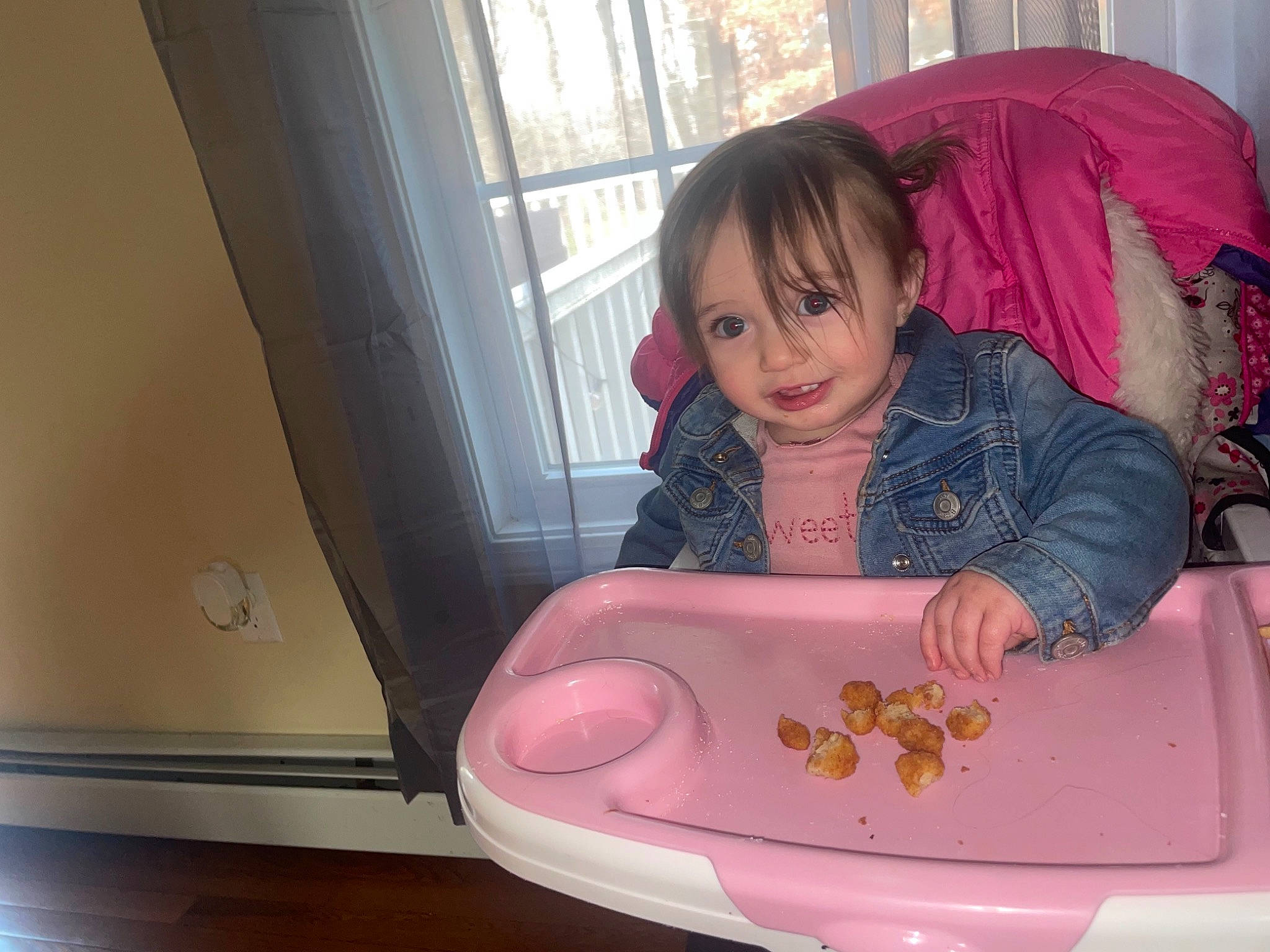 Aliyana is registered to the contest to win money with this photo: baby, baby_products, baby_toddler_clothing, child, comfort, electronic_device, facial_expression, flooring, fun, gadget, happy, home_appliance, magenta, person, pink, purple, room, serveware, sitting, toddler